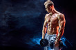 © zamuruev - Topless man exercising biceps with dumbbells posing in studio full of colored smoke