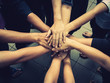 © Meng_Dakara - Teamwork concept; many people standing hands together in field before starting competition game