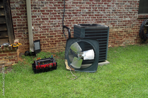 Fotografia, Obraz Air Conditioner Condenser coil with tools being repaired