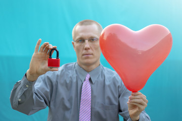 Businessman holding red padlock and red heart balloon. Security, Kindness, Friendliness, Love. Like assessment evaluation secure feedback business concept.