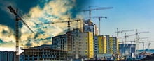 Construction Of New Residential Buildings Against The Sky . The Concept Of The Construction Business .