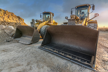 Two excavators working as a team for the construction of a road between Madrid - Segovia - Valladolid in Spain