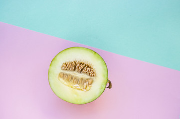 Canvas Print - Ripe freshly cut sweet delicious melon on bright colors background with copyspace.