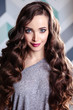 © cherry_d - Beautiful young brunette woman with long curly hair and evening makeup, fashion beauty portrait, casual clothes