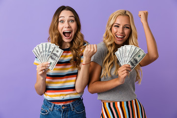 Wall Mural - Two pretty happy young girls friends standing