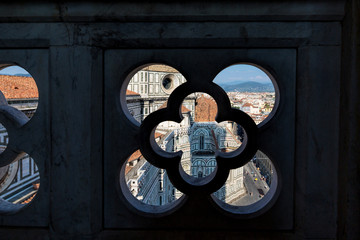 Wall Mural - Looking through a decorative window in Giotto's campanile towards the duomo in Florence