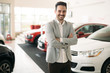 © NDABCREATIVITY - Portrait of happy customer buying new car