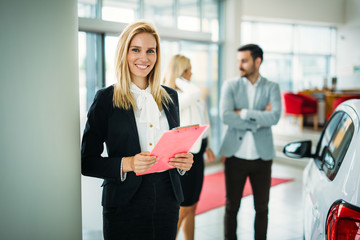 Picture of attractive saleswoman working in company