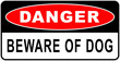 Danger sign in : beware of the dog - naughty dog - guard dog