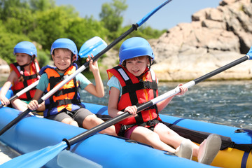 Wall Mural - little children kayaking on river. summer camp