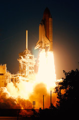 Wall Mural - launch of the spaceship from the spaceport at night. flight of space shuttle in clouds of smoke. som