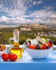 Wall Mural - Famous Acropolis with Greek salad in Athens, Greece