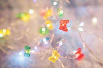 Wall Mural - Christmas lights. Glowing beautiful garland, Christmas decorations, winter holidays, New Year.