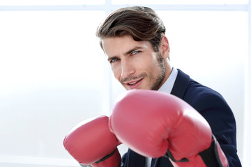 Wall Mural - Businessman standing posture with boxing gloves