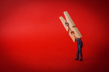 businessman clothespin headache