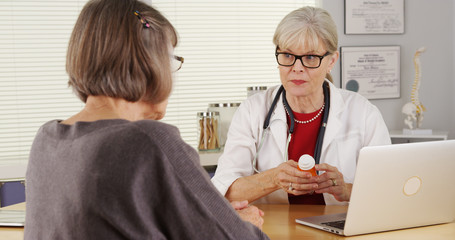 Wall Mural - Senior doctor patient giving prescription medication