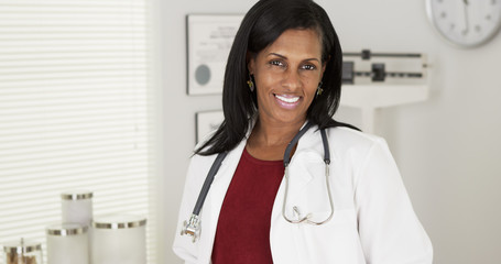 Portrait of happy Black doctor smiling at camera