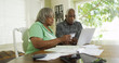 © Mark Adams - Senior black couple paying credit card online