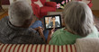 © Mark Adams - Black grandparents video chatting with granddaughter on tablet