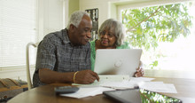 Senior Black Couple On The Laptop Computer