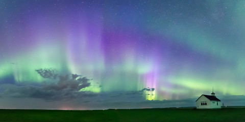 swirl of aurora borealis northern lights over the historical north saskatchewan landing school estab