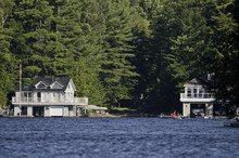 Cottage And A Boathouse
