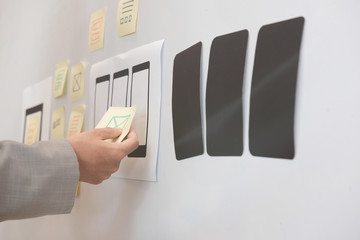 user experience ux designer designing web on smartphone layout. ui planning mobile application. deve