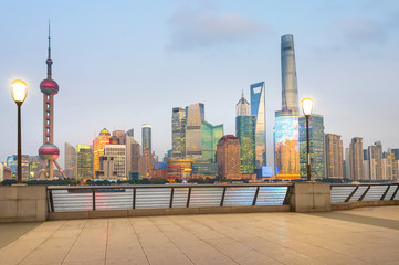 Wall Mural - Illuminated Shanghai skyline from embankment