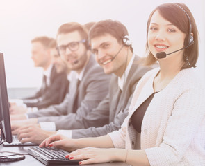 Poster - female customer service representative and colleagues in the call center