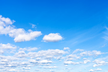 Wall Mural - weather front from many fluffy clouds in blue sky