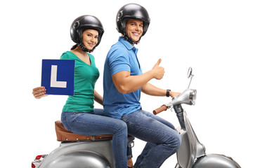 Poster - Young woman with an L-sign and a young man holding his thumb up riding a vintage scooter