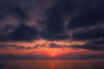Wall Mural - dark cloudscape sunset over the sea