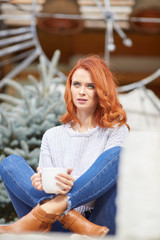 Wall Mural - Outdoors portrait of beautiful woman with red hair and smoky eyes makeup