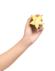 Wall Mural - hand holding slice starfruit or carambola isolated on white background