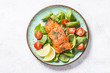 canvas print picture - Baked salmon fish fillet with fresh salad top view.