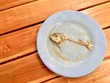 Fish bone (mackerel) on dirty dish