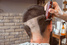 Haircut Hair Machine In The Barbershop. Haircut Bald