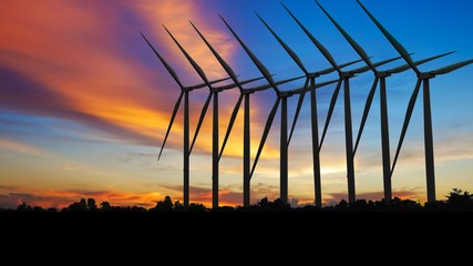 Silhouettes Wind turbine power generators at sunset, Alternative renewable energy production, Large wind turbine for electric