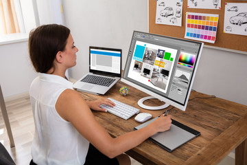 Wall Mural - Female Designer Working On Computer