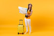 Traveler tourist woman in summer casual clothes, hat with suitcase, city map isolated on yellow orange background. Passenger traveling abroad to travel on weekends getaway. Air flight journey concept.