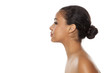 © vladimirfloyd - profile of young beautiful dark-skinned woman with bun on a white background
