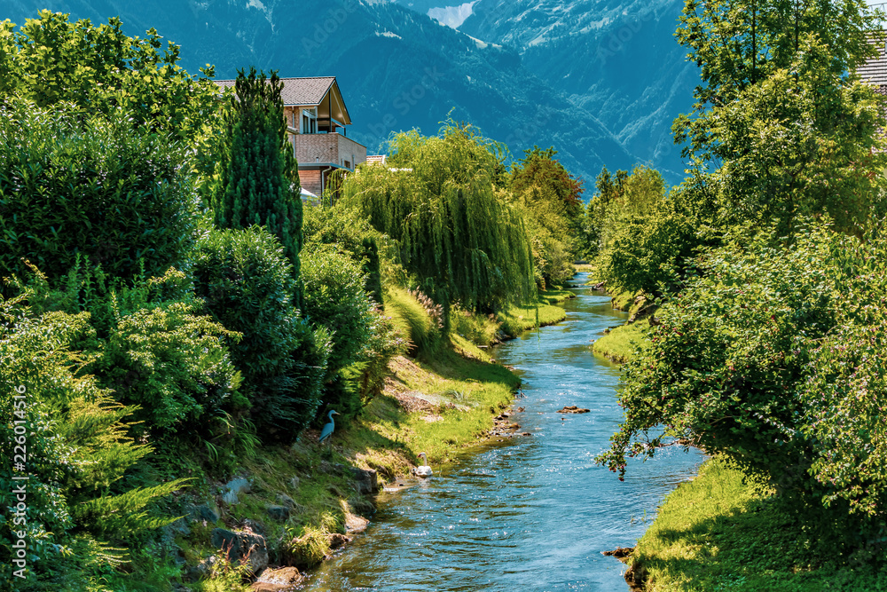 Obraz na płótnie A river in Vaduz, Liechtenstein w salonie