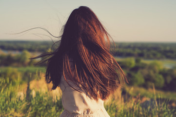 Relaxed young woman looking out into the view.