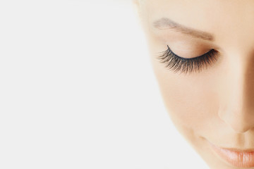 Wall Mural - beautiful girl with long false eyelashes and perfect skin. eyelash extensions, cosmetology, beauty a