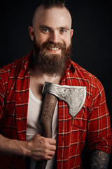 Wall Mural - Bearded man in studio with axe on chest