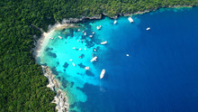 Aerial Drone Bird's Eye View Photo Of Iconic Paradise Sandy Beach Of Blue Lagoon With Deep Turquoise Clear Sea And Pine Trees  In Complex Island Of Mourtos In Sivota Area, Epirus, Greece