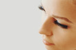 © Olesia - Beautiful girl with long false eyelashes and perfect skin. Eyelash extensions, cosmetology, beauty and skin care