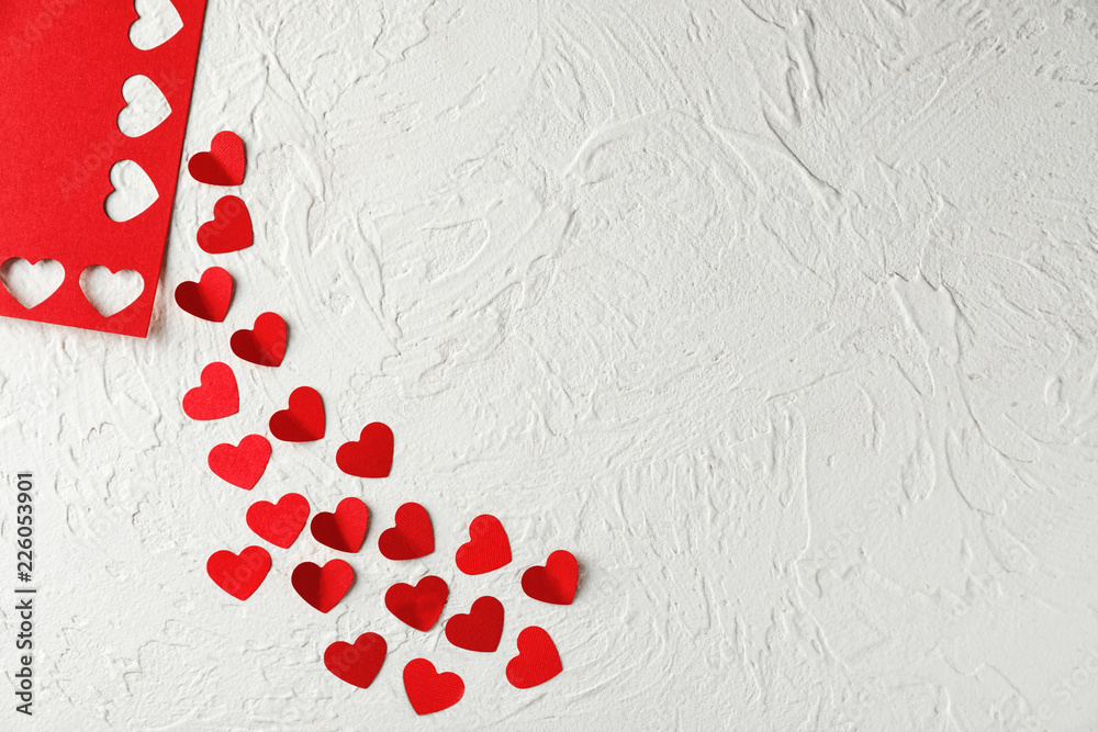 Red hearts on white textured background