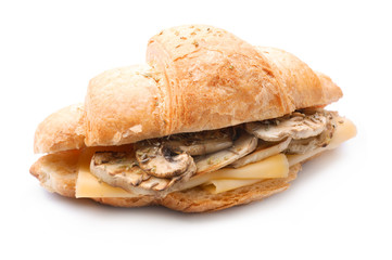 Tasty croissant sandwich with mushrooms on white background