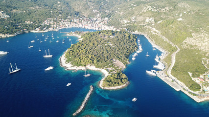 Aerial drone bird's eye view photo of iconic small safe port of Gaios with traditional Ionian architecture and sail boats docked, Paxos island, Ionian, Greece